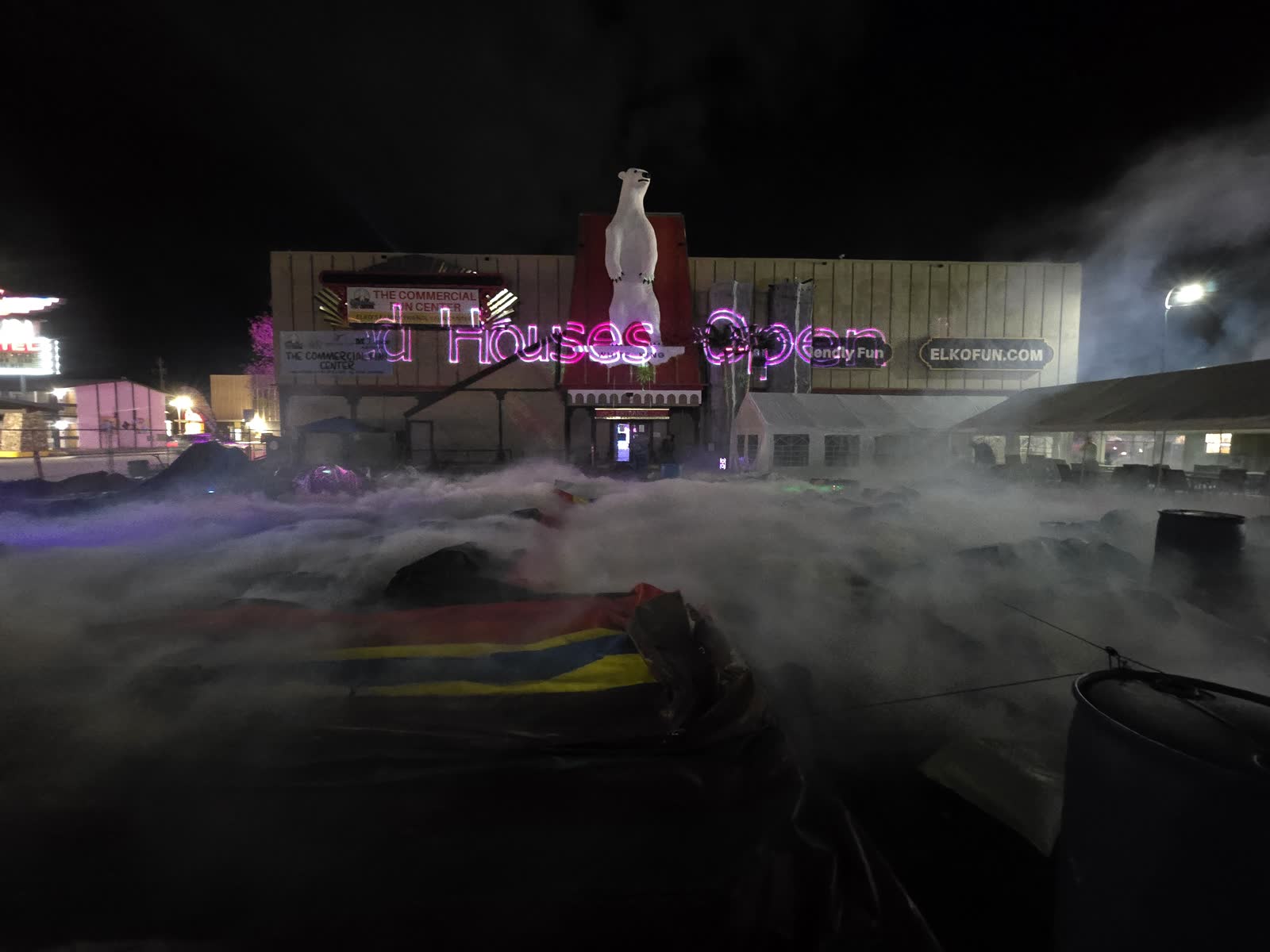 The Commercial Fun Center exterior at night with fog outside.